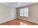 Bright bedroom with hardwood floors, a neutral color palette and ample natural light at 1657 Hampton Woods Way, Lawrenceville, GA 30043