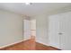Bedroom featuring hardwood floors, neutral paint, and double closets at 1657 Hampton Woods Way, Lawrenceville, GA 30043