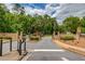 Gated community entrance featuring manicured landscaping at 1657 Hampton Woods Way, Lawrenceville, GA 30043