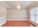 Elegant dining room with hardwood floors, a chandelier, and ample natural light at 1657 Hampton Woods Way, Lawrenceville, GA 30043