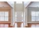 Elegant foyer with hardwood floors, white pillars, and a view of the front door at 1657 Hampton Woods Way, Lawrenceville, GA 30043