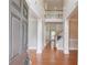 Grand foyer with soaring ceilings, hardwood floors, and an open staircase at 1657 Hampton Woods Way, Lawrenceville, GA 30043