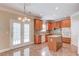 Kitchen with tile floors, island and stainless appliances at 1657 Hampton Woods Way, Lawrenceville, GA 30043