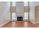 Living room featuring a fireplace with high ceilings and hardwood floors at 1657 Hampton Woods Way, Lawrenceville, GA 30043