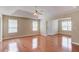 Spacious main bedroom with tray ceilings, fan and ample natural light at 1657 Hampton Woods Way, Lawrenceville, GA 30043