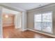 Neutral living room with hardwood floors, decorative pillars, and a view to the dining room at 1657 Hampton Woods Way, Lawrenceville, GA 30043