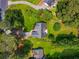 Bird's eye view of a well-maintained property featuring a spacious lawn, mature trees, and a charming neighborhood at 1978 Elmwood Cir, Snellville, GA 30078