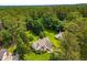 Aerial view showcasing a well-maintained home with lush landscaping and mature trees in a serene neighborhood at 1978 Elmwood Cir, Snellville, GA 30078