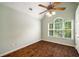 Bedroom with vaulted ceiling, ceiling fan, and large window at 1978 Elmwood Cir, Snellville, GA 30078