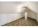 Large bonus room with unique flooring, ceiling fan, and ample space at 1978 Elmwood Cir, Snellville, GA 30078