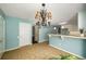 This dining area is spacious with tile flooring and a decorative chandelier at 1978 Elmwood Cir, Snellville, GA 30078