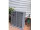 Brand new RUNTRU HVAC unit outside of a home with modern, gray siding at 1978 Elmwood Cir, Snellville, GA 30078