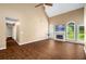 Open living room with wood flooring, a fireplace, large windows, and neutral color scheme at 1978 Elmwood Cir, Snellville, GA 30078