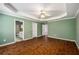 This main bedroom offers wood floors, a trey ceiling, and an ensuite bathroom at 1978 Elmwood Cir, Snellville, GA 30078