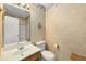 Bathroom featuring a vanity with a sink, toilet, and separate shower area at 524 Stephens Point Se Dr, Lawrenceville, GA 30045