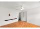 Clean bedroom offers wood floors, a ceiling fan, and closet with folding doors at 524 Stephens Point Se Dr, Lawrenceville, GA 30045