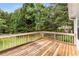 Wooden deck overlooking a lush backyard, perfect for outdoor entertaining and relaxation at 524 Stephens Point Se Dr, Lawrenceville, GA 30045
