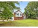 Charming home with a lush front lawn and mature trees offering ample shade at 524 Stephens Point Se Dr, Lawrenceville, GA 30045