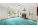 Bright living room with fireplace, large windows, and door to outdoor deck at 524 Stephens Point Se Dr, Lawrenceville, GA 30045