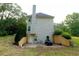 Rear view of home featuring a walkout basement, vinyl siding and an open outdoor parking area at 8601 Flint Hill Rd, Douglasville, GA 30135