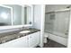 Bathroom features granite countertop, tiled floors, and a bathtub/shower combo at 8601 Flint Hill Rd, Douglasville, GA 30135