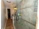 Bathroom showing a glass enclosed shower, tiled walls and flooring, and neutral color palette at 8601 Flint Hill Rd, Douglasville, GA 30135