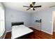 Neutral bedroom features wood floors, large windows and a ceiling fan at 8601 Flint Hill Rd, Douglasville, GA 30135