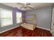 Bedroom features hardwood floors and a house-shaped bed at 8601 Flint Hill Rd, Douglasville, GA 30135
