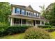 Inviting home with a covered front porch perfect for relaxing outdoors at 8601 Flint Hill Rd, Douglasville, GA 30135