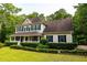 Classic home with a covered porch and well-maintained landscaping at 8601 Flint Hill Rd, Douglasville, GA 30135