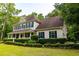 Desirable home with a covered front porch and neatly trimmed shrubbery at 8601 Flint Hill Rd, Douglasville, GA 30135