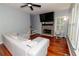 Comfortable living room boasts a stone fireplace, large TV, and bright windows at 8601 Flint Hill Rd, Douglasville, GA 30135