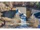 An aerial view of a landscaped home with a sprawling backyard and a well-maintained driveway at 1029 Harvest Brook Dr, Lawrenceville, GA 30043