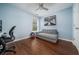 Bedroom featuring hardwood floors, light blue walls, and natural light at 1029 Harvest Brook Dr, Lawrenceville, GA 30043