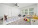 Bright bedroom with a ceiling fan, double door closet, and carpeted floor at 1029 Harvest Brook Dr, Lawrenceville, GA 30043