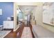 Inviting foyer with hardwood floors, neutral tones, and stylish decor create a warm welcome at 1029 Harvest Brook Dr, Lawrenceville, GA 30043