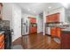 Spacious kitchen features wood floors, stainless steel appliances, and ample cabinet space at 1029 Harvest Brook Dr, Lawrenceville, GA 30043