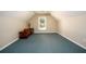 Finished attic space with carpet flooring and window at 1304 Carrington Way, Lawrenceville, GA 30044