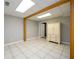 Basement room featuring tile floor and a white cabinet at 1304 Carrington Way, Lawrenceville, GA 30044
