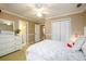 Cozy bedroom with a ceiling fan, double closets, and neutral walls, creating a peaceful ambiance at 1304 Carrington Way, Lawrenceville, GA 30044
