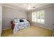 Comfortable bedroom with daybed, and neutral walls, providing a relaxing and inviting atmosphere at 1304 Carrington Way, Lawrenceville, GA 30044