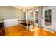A dining area featuring a wooden table set with access to the outdoor deck at 1304 Carrington Way, Lawrenceville, GA 30044