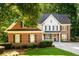 Charming brick home with black shutters and manicured landscaping for great curb appeal at 1304 Carrington Way, Lawrenceville, GA 30044