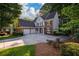 Charming two-story brick home with a large driveway and well-manicured landscaping at 1304 Carrington Way, Lawrenceville, GA 30044