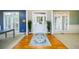 Bright foyer with hardwood floors, decorative rug, and plenty of natural light at 1304 Carrington Way, Lawrenceville, GA 30044