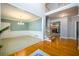 Open foyer showcasing hardwood floors and staircase with wainscotting at 1304 Carrington Way, Lawrenceville, GA 30044