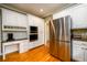 The well-equipped kitchen features stainless steel appliances and ample cabinet space at 1304 Carrington Way, Lawrenceville, GA 30044