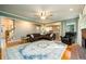 Large living room with hardwood floors, a decorative rug, and a fireplace at 1304 Carrington Way, Lawrenceville, GA 30044