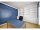 Office with built-in bookshelves, wainscotting, and ample natural light at 1304 Carrington Way, Lawrenceville, GA 30044