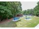 Scenic community picnic area with picnic tables and a covered pavilion surrounded by lush greenery at 1304 Carrington Way, Lawrenceville, GA 30044